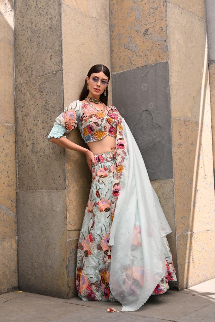 Buy Powder White Lehenga And Off Shoulder Crop Top With Bishop Sleeves,  Hand Embroidery And An Elaborate Bow Online - Kalki Fashion